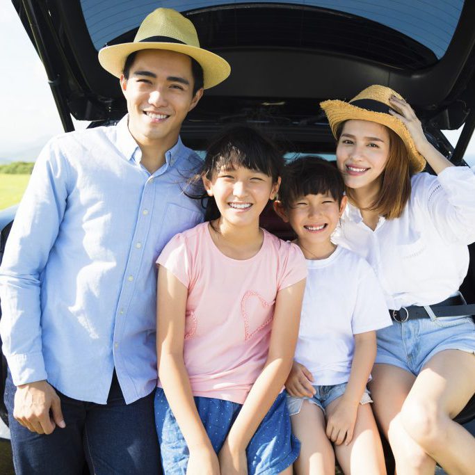 happy family enjoying road trip and summer vacation